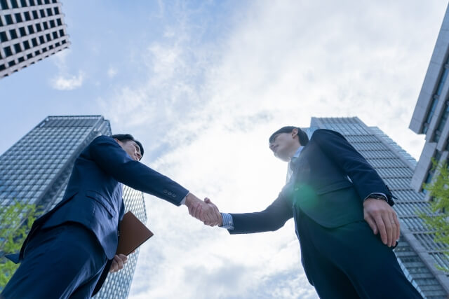 two businessmen shaking hands